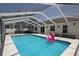 The refreshing, screened-in pool and patio area provide the ultimate backyard experience at 3359 Sanoma Dr, Lakeland, FL 33811