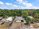 Expansive aerial view of the home, showcasing the surrounding lush greenery and neighborhood layout at 36912 Skycrest Blvd, Fruitland Park, FL 34731