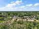 Sweeping aerial view highlighting the home's location and surrounding natural beauty at 36912 Skycrest Blvd, Fruitland Park, FL 34731