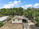 Aerial view of the home showing its location surrounded by lush trees and nearby homes at 36912 Skycrest Blvd, Fruitland Park, FL 34731