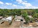 Expansive aerial shot showcasing the home's setting amidst lush greenery at 36912 Skycrest Blvd, Fruitland Park, FL 34731