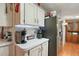 Cozy kitchen with stainless steel appliances and ample counter space, conveniently located near additional storage at 36912 Skycrest Blvd, Fruitland Park, FL 34731