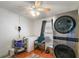 Bright laundry area featuring a modern washer/dryer, storage, and natural light at 36912 Skycrest Blvd, Fruitland Park, FL 34731