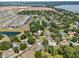 Aerial view of the home and its surrounding community with a scenic lake at 3805 Gaines Dr, Winter Haven, FL 33884