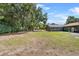 Spacious backyard featuring a large, screened-in pool at 3805 Gaines Dr, Winter Haven, FL 33884