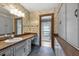 Charming bathroom with floral wallpaper, granite countertops, and plenty of storage at 3805 Gaines Dr, Winter Haven, FL 33884