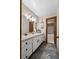 Bathroom featuring a white vanity, mirror, decorative wallpaper, and tub/shower combo at 3805 Gaines Dr, Winter Haven, FL 33884