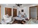 Bedroom with a white chair and crib, with natural wood accents, and plush rug at 3805 Gaines Dr, Winter Haven, FL 33884