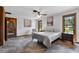 Bright bedroom boasts tile floors, ceiling fan, and large windows at 3805 Gaines Dr, Winter Haven, FL 33884