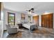 Inviting bedroom showcasing tile floors, ceiling fan, and closet space at 3805 Gaines Dr, Winter Haven, FL 33884