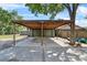 Open carport next to a home providing shaded parking and easy access to the house at 3805 Gaines Dr, Winter Haven, FL 33884