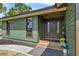 Close-up of a home's entrance featuring a double door design, enhanced by colorful potted plants, creating an inviting entrance at 3805 Gaines Dr, Winter Haven, FL 33884