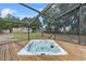 Outdoor hot tub in screened in deck area at 3805 Gaines Dr, Winter Haven, FL 33884