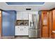 Bright kitchen showcases stainless steel refrigerator and modern appliances, perfect for culinary enthusiasts at 3805 Gaines Dr, Winter Haven, FL 33884