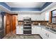 Modern kitchen features granite counters, stainless steel appliances, and convenient access to a dining area at 3805 Gaines Dr, Winter Haven, FL 33884