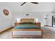 Comfortable main bedroom boasting wood accents, ample natural light, and serene decor for relaxation at 3805 Gaines Dr, Winter Haven, FL 33884
