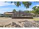 Exterior shot of a home with a large screened-in pool area at 3805 Gaines Dr, Winter Haven, FL 33884