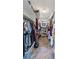 Walk-in closet with built-in shelving and rods for ample storage at 3805 Gaines Dr, Winter Haven, FL 33884