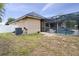 Backyard with pool, privacy screen, and green space at 3812 Cheverly E Dr, Lakeland, FL 33813