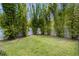 Secluded backyard with tall bamboo trees and a well-maintained lawn at 3812 Cheverly E Dr, Lakeland, FL 33813