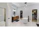 Spa-like bathroom featuring a soaking tub, modern vanity, and walk-in closet at 3812 Cheverly E Dr, Lakeland, FL 33813