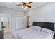 Spacious bedroom with a queen bed and access to bathroom and closet at 3812 Cheverly E Dr, Lakeland, FL 33813