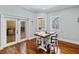 Bright breakfast nook featuring hardwood floors and views of the pool area at 3812 Cheverly E Dr, Lakeland, FL 33813