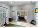 Bright golf room with putting green and seamless transition to the screened outdoor pool area at 3812 Cheverly E Dr, Lakeland, FL 33813