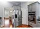 Modern kitchen with stainless steel appliances and gray cabinetry with granite countertops at 3812 Cheverly E Dr, Lakeland, FL 33813