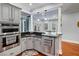 Open kitchen and eat-in area featuring stainless appliances and a breakfast bar at 3812 Cheverly E Dr, Lakeland, FL 33813