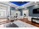 Open-concept living room with hardwood floors, French doors, and great natural light at 3812 Cheverly E Dr, Lakeland, FL 33813