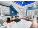 Open-concept living room with hardwood floors, staircase, and adjacent kitchen at 3812 Cheverly E Dr, Lakeland, FL 33813