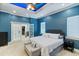 The main bedroom features a tray ceiling with French doors leading to a walk-in closet at 3812 Cheverly E Dr, Lakeland, FL 33813