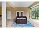 Covered outdoor patio with a high-top table set with seating at 3812 Cheverly E Dr, Lakeland, FL 33813