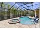 Outdoor pool and spa in a screened enclosure with seating at 3812 Cheverly E Dr, Lakeland, FL 33813