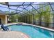 Screened in swimming pool and spa with paver deck and privacy landscaping at 3812 Cheverly E Dr, Lakeland, FL 33813