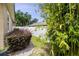 Side yard with privacy fence and lush greenery at 3812 Cheverly E Dr, Lakeland, FL 33813