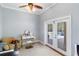 Bright sitting room with backyard pool access through glass French doors at 3812 Cheverly E Dr, Lakeland, FL 33813