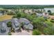 Stunning aerial view of the home nestled in a lush, green neighborhood near a serene lake at 3852 Serenade Ln, Lakeland, FL 33811