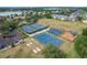 Aerial view of the tennis and basketball courts and playground within the community at 3852 Serenade Ln, Lakeland, FL 33811