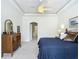 Elegant bedroom with tray ceiling, ceiling fan, classic decor, and ample closet space at 3852 Serenade Ln, Lakeland, FL 33811