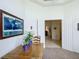 Bright entryway with a world map art piece, decorous plant, and an open doorway at 3852 Serenade Ln, Lakeland, FL 33811