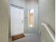This home's entryway has a secure door and welcoming aesthetic at 3852 Serenade Ln, Lakeland, FL 33811