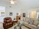 Inviting living room showcasing a mix of comfortable seating, wooden furniture, and tasteful decor at 3852 Serenade Ln, Lakeland, FL 33811