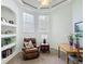 Bright office nook featuring a leather chair, built in shelves, a table and windows at 3852 Serenade Ln, Lakeland, FL 33811