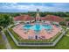 Aerial view of a community pool and hot tub with ample seating and shade at 3852 Serenade Ln, Lakeland, FL 33811