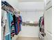 Organized walk-in closet with multiple shelves and hanging rods for ample storage at 3852 Serenade Ln, Lakeland, FL 33811