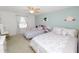 Spacious bedroom with two beds, a ceiling fan, and plenty of natural light at 3857 Hampstead Ln, Lakeland, FL 33810