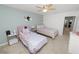 Bedroom featuring two twin beds, complemented by soft wall decor and ample natural light at 3857 Hampstead Ln, Lakeland, FL 33810
