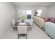 Well-lit dining area featuring contemporary furniture and seamless access to the living space and patio at 3857 Hampstead Ln, Lakeland, FL 33810